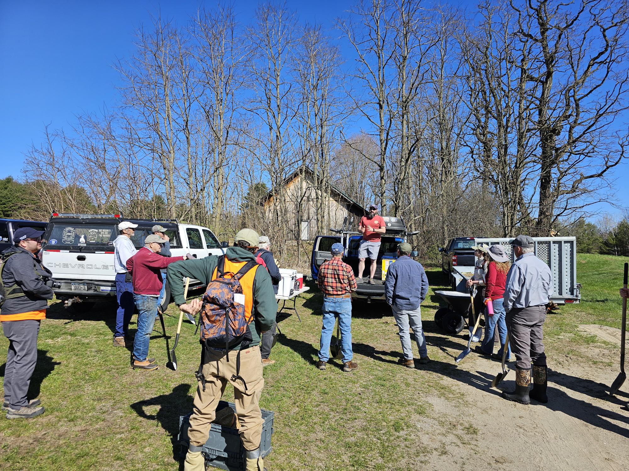 Volunteers plant trees along the Boquet River